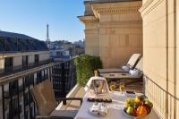 a table with a bowl of fruit on a balcony at Hôtel Raphael in Paris