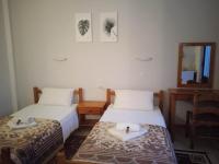 Postel nebo postele na pokoji v ubytování Villa Kaloudis Rooms
