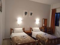 Postel nebo postele na pokoji v ubytování Villa Kaloudis Rooms