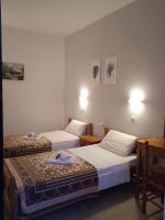 Postel nebo postele na pokoji v ubytování Villa Kaloudis Rooms