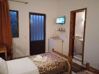 Postel nebo postele na pokoji v ubytování Villa Kaloudis Rooms