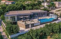 an aerial view of a house with a swimming pool at Amazing Home In Kastel Stari With Kitchen in Kastel Novi
