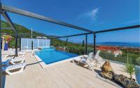 a villa with a swimming pool on a roof at Amazing Home In Kastel Stari With Kitchen in Kastel Novi