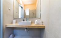 a bathroom with a sink and a mirror at Amazing Home In Kastel Stari With Kitchen in Kastel Novi