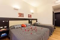 A bed or beds in a room at Domus Best Guest House
