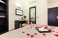 A bed or beds in a room at Domus Best Guest House
