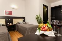 A bed or beds in a room at Domus Best Guest House