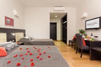 A bed or beds in a room at Domus Best Guest House