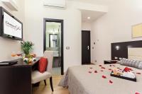 A bed or beds in a room at Domus Best Guest House