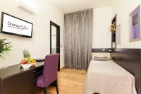 A bed or beds in a room at Domus Best Guest House