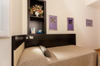 A bed or beds in a room at Domus Best Guest House