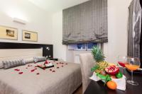 A bed or beds in a room at Domus Best Guest House