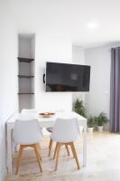 Televízia a/alebo spoločenská miestnosť v ubytovaní Villa Infante
