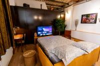 Televízia a/alebo spoločenská miestnosť v ubytovaní Loft au bèu mitan - 50m2