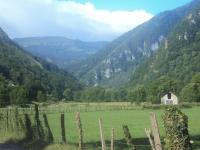 a fence in a field with mountains in the background at GITE LES 3 EDELWEISS - Maison SEGUITTE - 6 PERSONNES in Arette