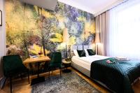 Łóżko lub łóżka w pokoju w obiekcie Arts Apartments - Kraków Old Town
