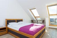 Posteľ alebo postele v izbe v ubytovaní DreamHouse Apartament „Laguna” ul. Wschodnia 12, Darłówko Wschodnie