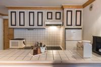 Kuchyňa alebo kuchynka v ubytovaní Appartement 3 chambres au cœur de Courchevel 1850