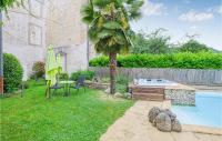 a backyard with a palm tree and a swimming pool at Cozy Apartment In Saint Jean Du Bruel With Private Swimming Pool, Can Be Inside Or Outside in Saint-Jean-du-Bruel