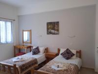 Postel nebo postele na pokoji v ubytování Villa Kaloudis Rooms