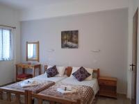 Postel nebo postele na pokoji v ubytování Villa Kaloudis Rooms