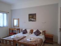 Postel nebo postele na pokoji v ubytování Villa Kaloudis Rooms