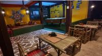 a dining room with tables and a pool table at Wild Hippie Chang in Ban Nong Si Chaeng