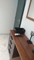 a remote control sitting on top of a wooden table at Gabi hostel in Cayenne