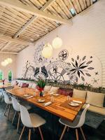 a dining room with a large wooden table and chairs at Casa na Lagoa in Paracuru