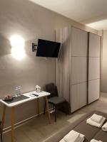 Televízia a/alebo spoločenská miestnosť v ubytovaní Rosy Bed&Breakfast