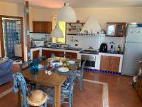 A kitchen or kitchenette at Villa Delfino Blu con accesso diretto al mare dalla scogliera e privacy impagabile.