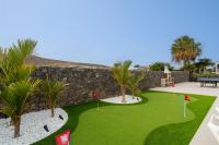 A garden outside Villa Sapphire by Villa Plus