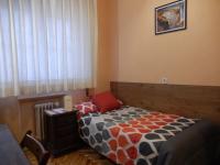 A bed or beds in a room at Hostal San Martin