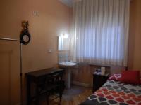 A bed or beds in a room at Hostal San Martin