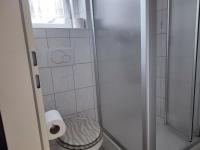 a small bathroom with a shower and a toilet at Gästehaus im Alten Fährhaus in Cochem