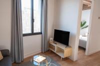 TV a/nebo společenská místnost v ubytování Feelathome Stadium Apartments