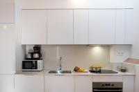 Kuchyň nebo kuchyňský kout v ubytování Feelathome Stadium Apartments