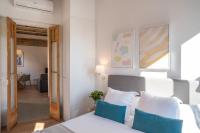 Postel nebo postele na pokoji v ubytování Feelathome Stadium Apartments