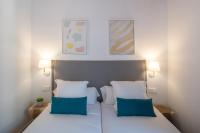 Postel nebo postele na pokoji v ubytování Feelathome Stadium Apartments