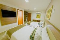 Plaza Inn Breeze Aeroportoにあるベッド