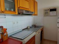 Kuchyňa alebo kuchynka v ubytovaní Grau d'Agde : Appartement 3 pièces avec terrasses à 20m de la plage - FR-1-423-265