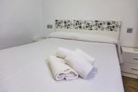 A bed or beds in a room at Apartment Triana