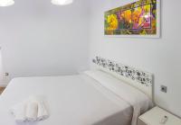 A bed or beds in a room at Apartment Triana