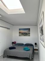 A bed or beds in a room at Manuda Luxury Apartment