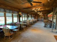 a dining room filled with tables and chairs at Deer Creek Winery at Watson Estate in Uniontown
