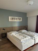 Postel nebo postele na pokoji v ubytování Marienlyst Apartment