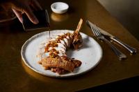 a plate with a piece of food on a table at No 42 by GuestHouse, Margate in Margate