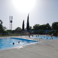 a group of people swimming in a swimming pool at CAMPING LE BEL AIR Mobil home L&#39;OLIVIER 4 personnes in Limogne-en-Quercy