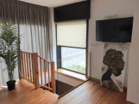 TV a/nebo společenská místnost v ubytování Apartamentos Ciudad Santiago