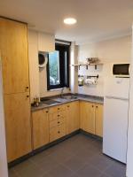Kuchyň nebo kuchyňský kout v ubytování Apartamentos Ciudad Santiago